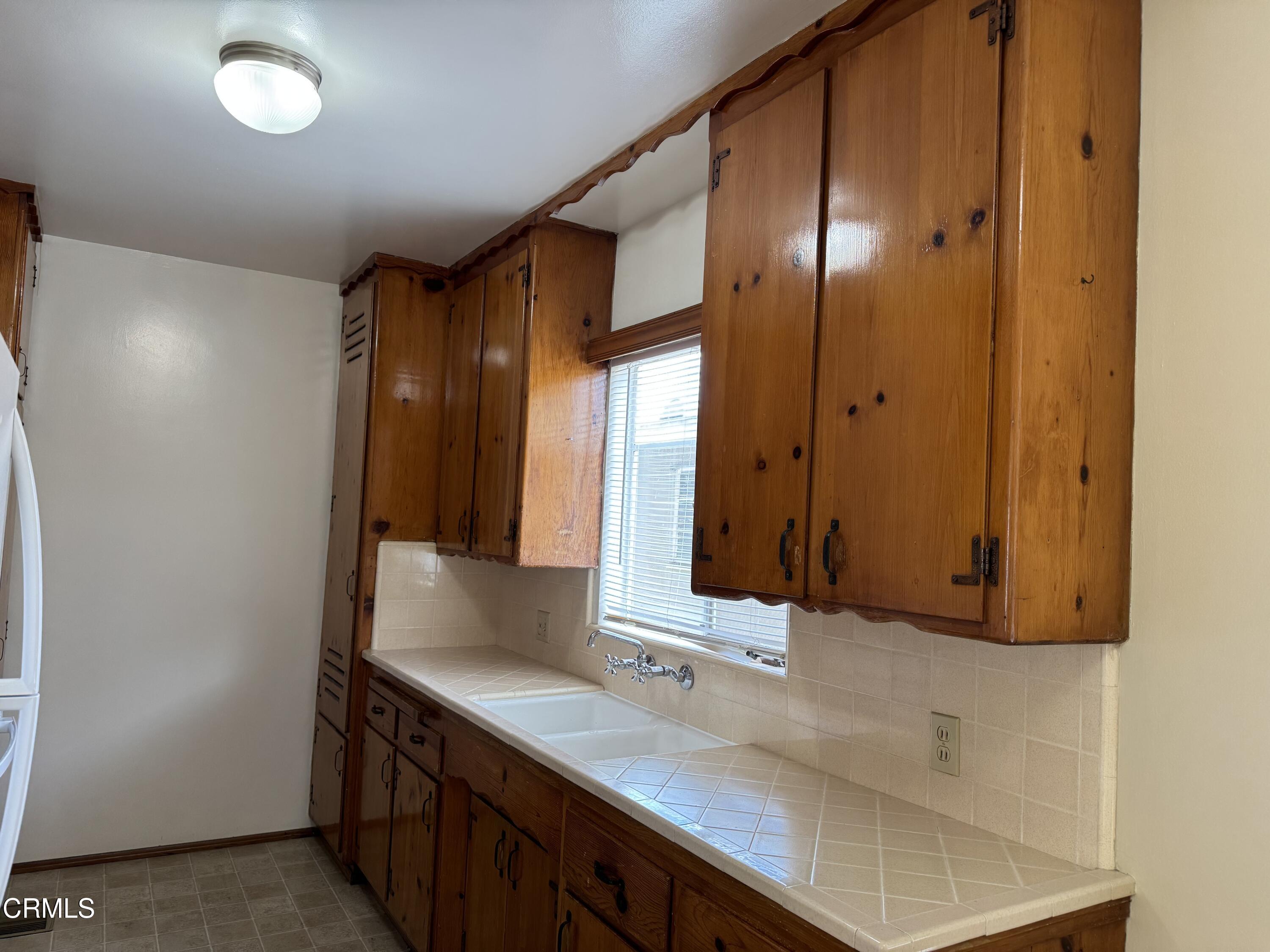 516 Linwood Avenue, Unit A Monrovia, CA 91016 - Photo 5 of 12 a bathroom with a sink and a mirror