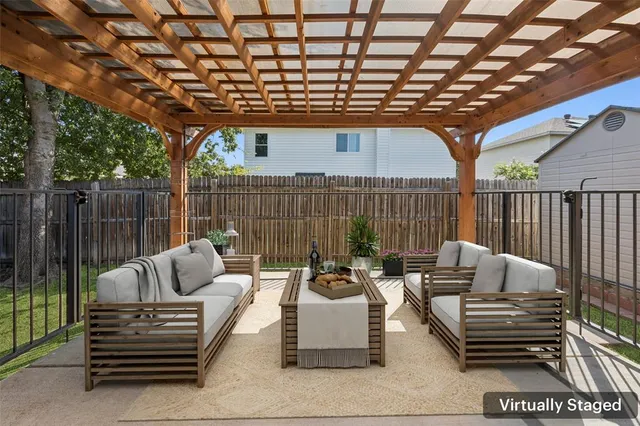 a outdoor living space with patio furniture and garden view
