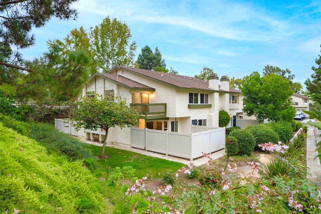 242 Countryhaven Road Encinitas, CA 92024 - Photo 1 of 1 a view of white house with a big yard and potted plants