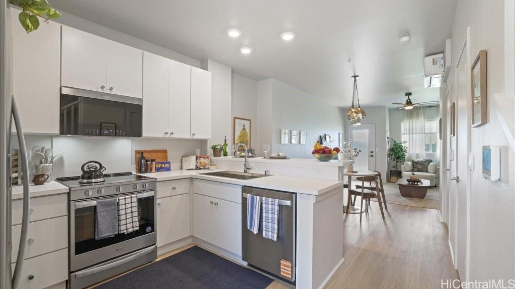 a kitchen with a sink a stove and cabinets