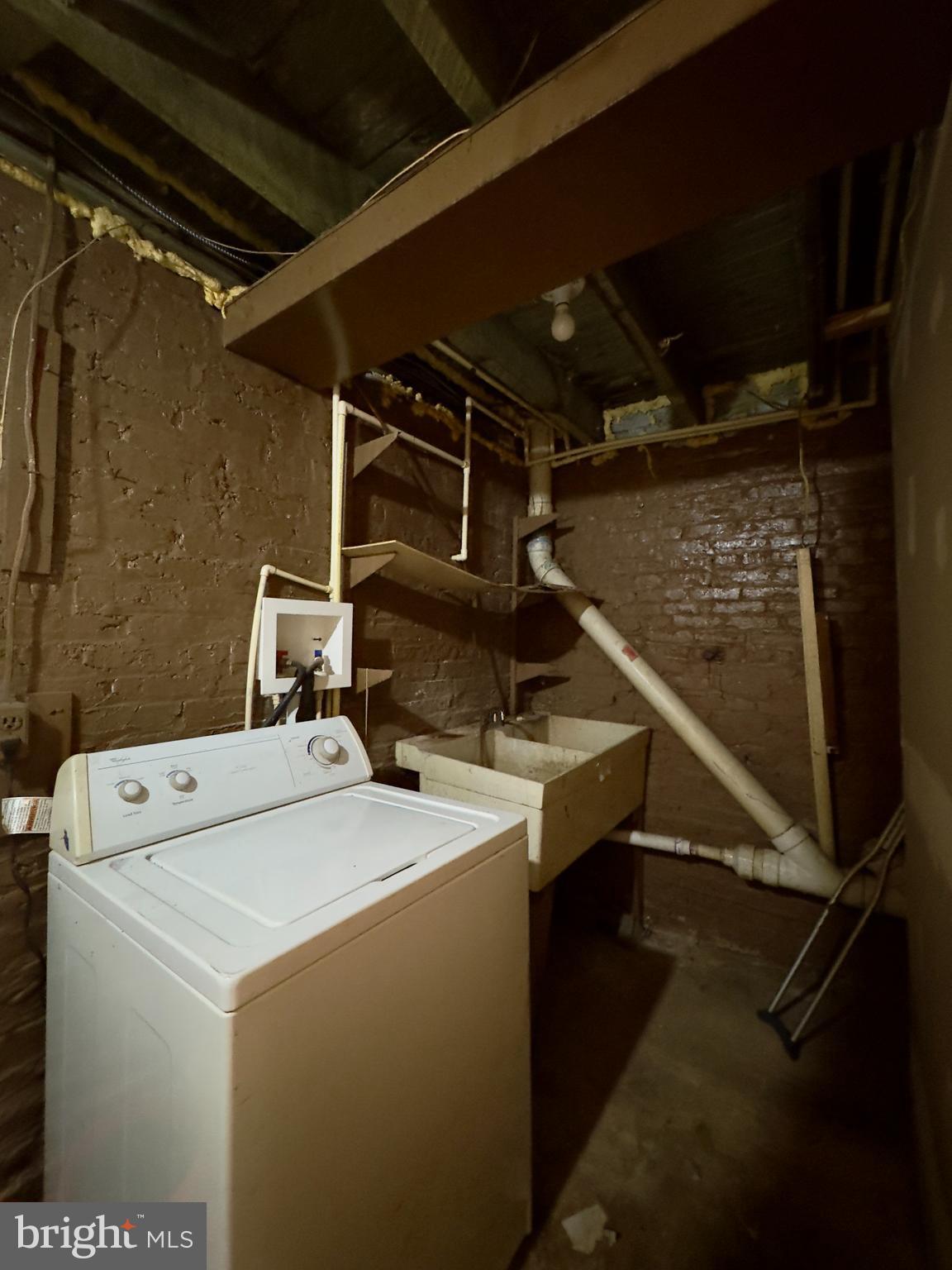 1931 Griffis Avenue Baltimore, MD 21230 - Photo 16 of 17 a utility room with dryer and washer