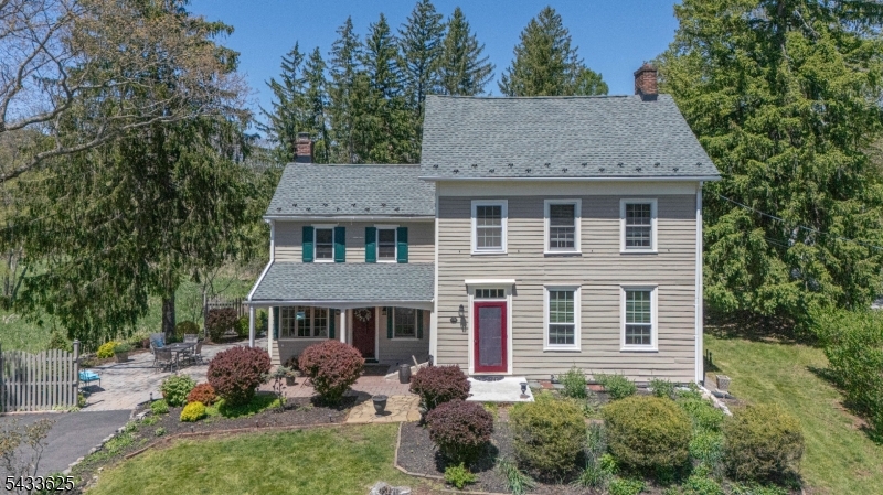 449 Stamets Road Milford, NJ 08848 - Photo 1 of 44 a front view of a house with a garden
