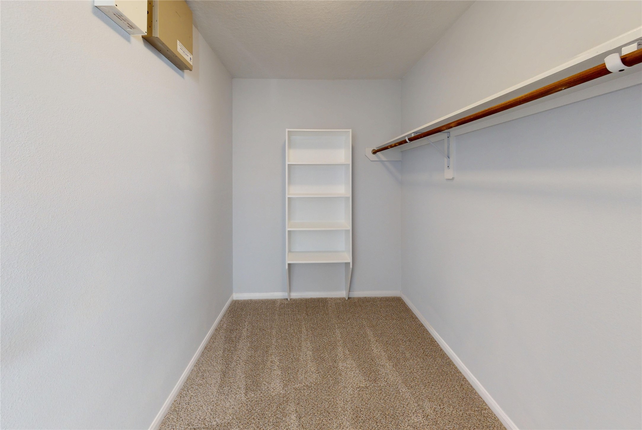 9877 Lace Flower Way Conroe, TX 77385 - Photo 24 of 43 Primary Closet with built-in shelving for shoes, sweaters, boots!