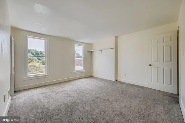 an empty room with windows