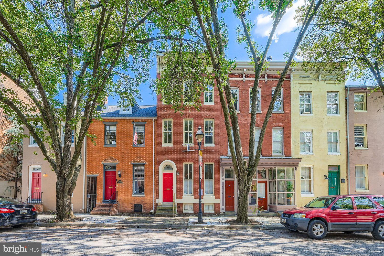 615 South Paca Street Baltimore, MD 21230 - Photo 34 of 34 a front view of a building with large trees