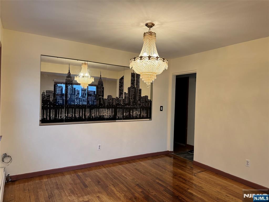 4 Chestnut Street Rutherford, NJ 07070 - Photo 14 of 29 a view of a room with wooden floor and chandelier