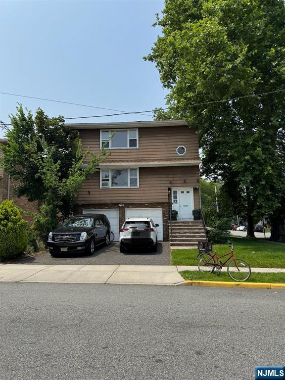 4 Chestnut Street Rutherford, NJ 07070 - Photo 3 of 29 a view of a car parked in front of a house