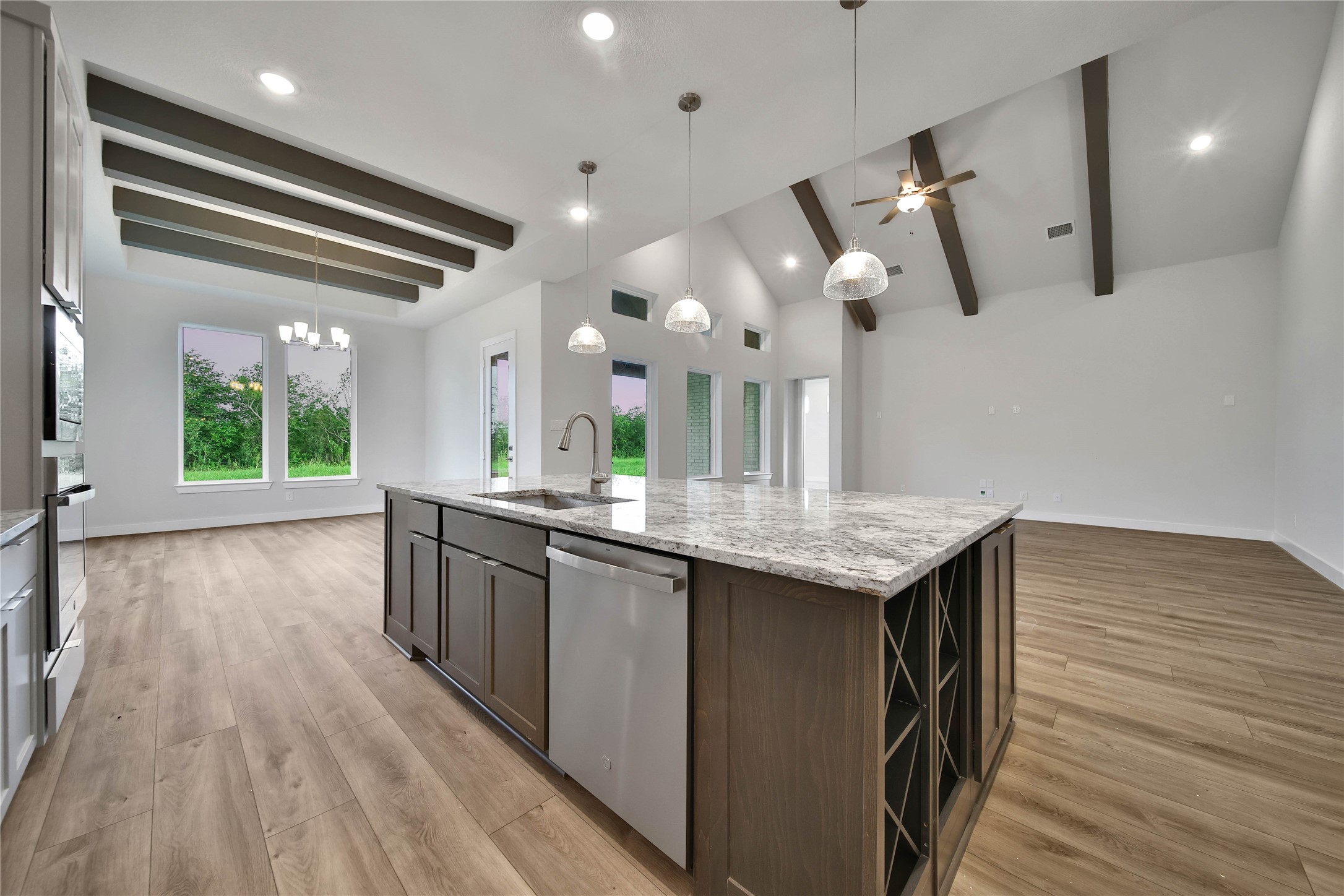 4602 Magnolia Bend Drive Rosharon, TX 77583 - Photo 9 of 39 a kitchen with stainless steel appliances granite countertop a stove and a wooden floors