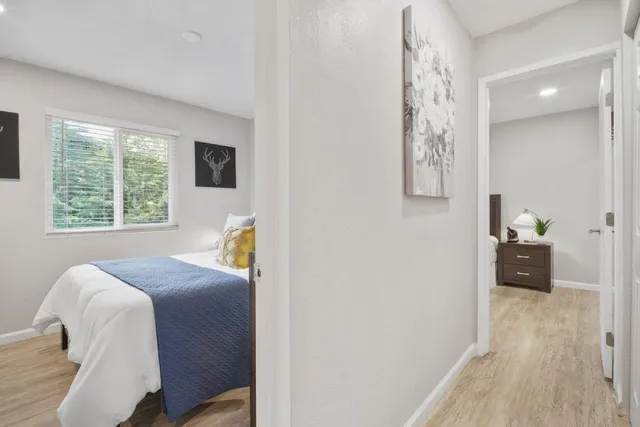 a bedroom with a bed and a window