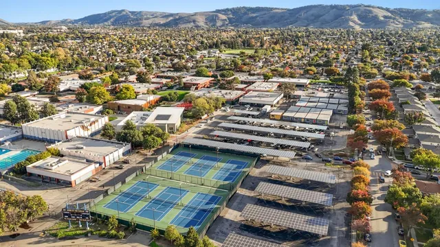 an aerial view of residential houses with outdoor space