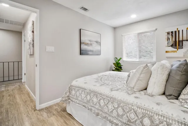 a large white bed in a white room