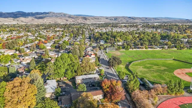 a view of a city with mountains in the background