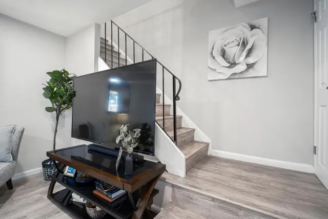 a living room with furniture and flowers