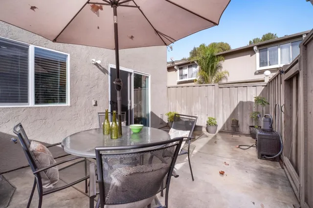 a view of an outdoor dining space with a patio