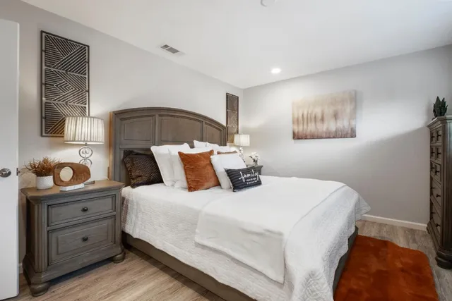 a bedroom with a bed and window