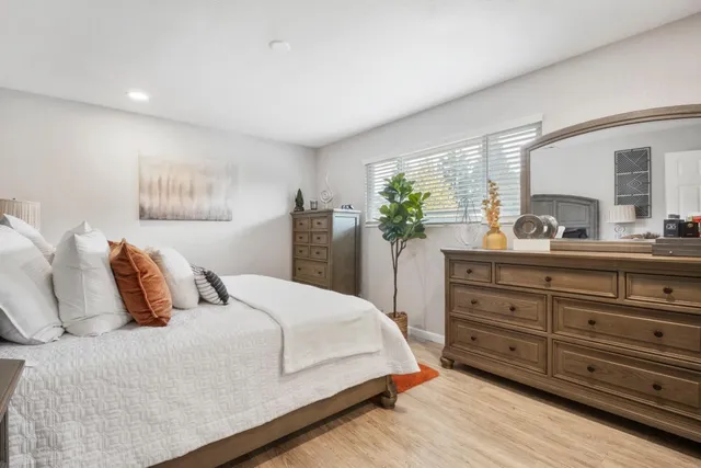 a bedroom with a bed and a dresser