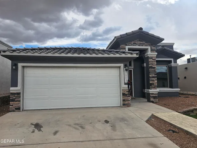 an outdoor space view with a brick wall