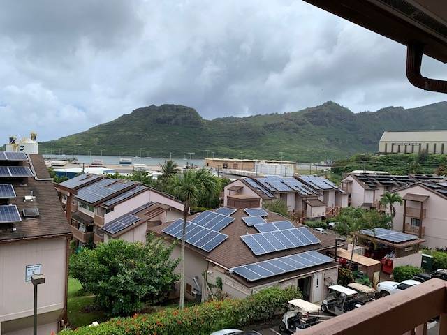 an aerial view of houses with a lake