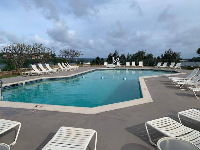 3411 Wilcox Road, Unit 110 Lihue, HI 96766 - Photo 11 of 12 a view of a swimming pool and lounge chairs