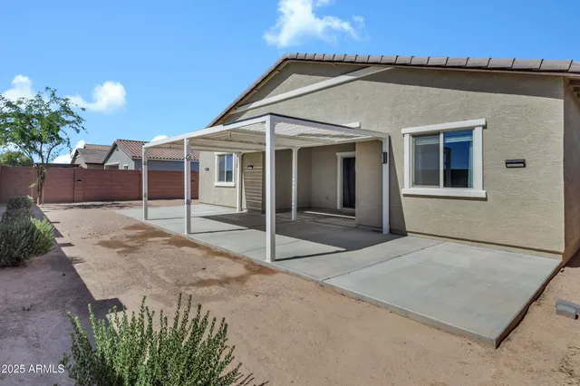 front view of a house with a fence