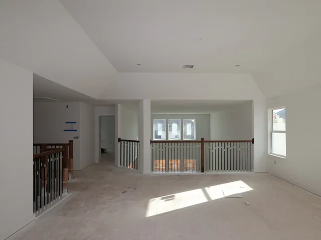 a view of a hallway with windows