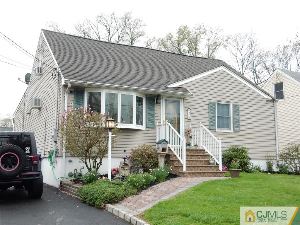 61 Kimberly Road Colonia, NJ 07067 - Photo 1 of 25 a front view of a house with a garden and plants