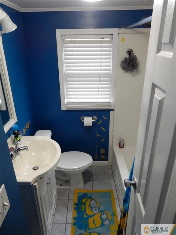 61 Kimberly Road Colonia, NJ 07067 - Photo 12 of 25 a bathroom with a sink a toilet and a shower
