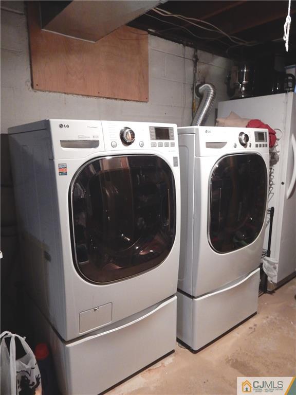 61 Kimberly Road Colonia, NJ 07067 - Photo 19 of 25 a utility room with dryer and washer