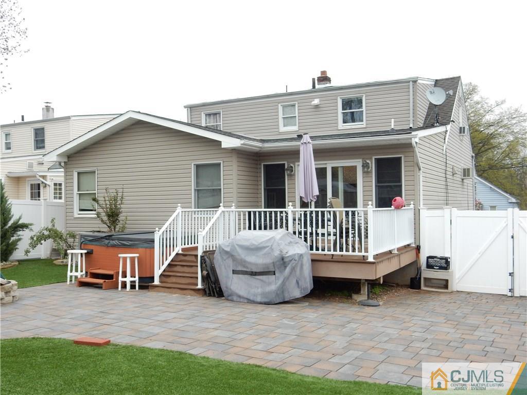 61 Kimberly Road Colonia, NJ 07067 - Photo 20 of 25 a view of a house with a wooden deck and a yard