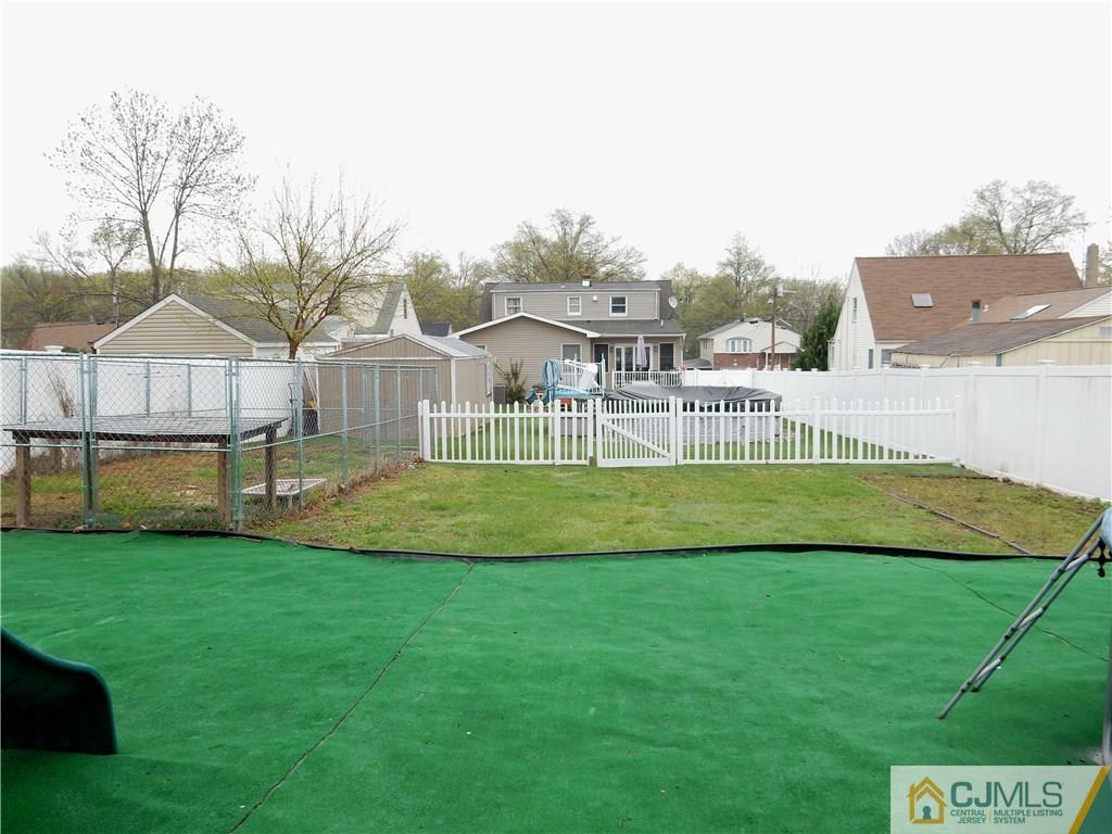 61 Kimberly Road Colonia, NJ 07067 - Photo 3 of 25 a view of house with a big yard