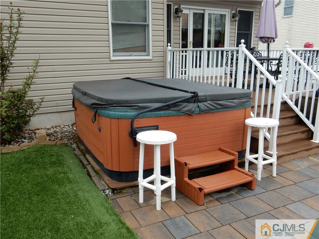 61 Kimberly Road Colonia, NJ 07067 - Photo 21 of 25 a backyard of a house with table and chairs