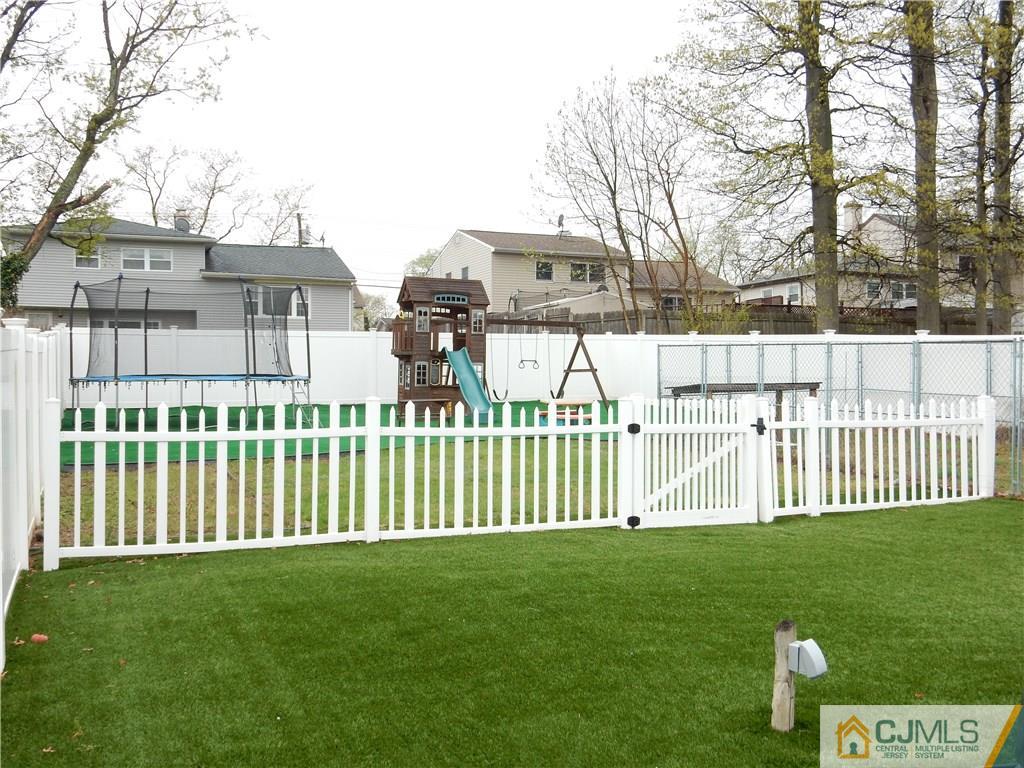 61 Kimberly Road Colonia, NJ 07067 - Photo 23 of 25 a front view of a house with a garden