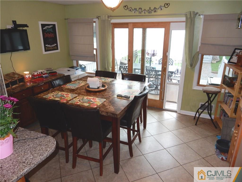 61 Kimberly Road Colonia, NJ 07067 - Photo 7 of 25 a view of a dining room with furniture window and outside view