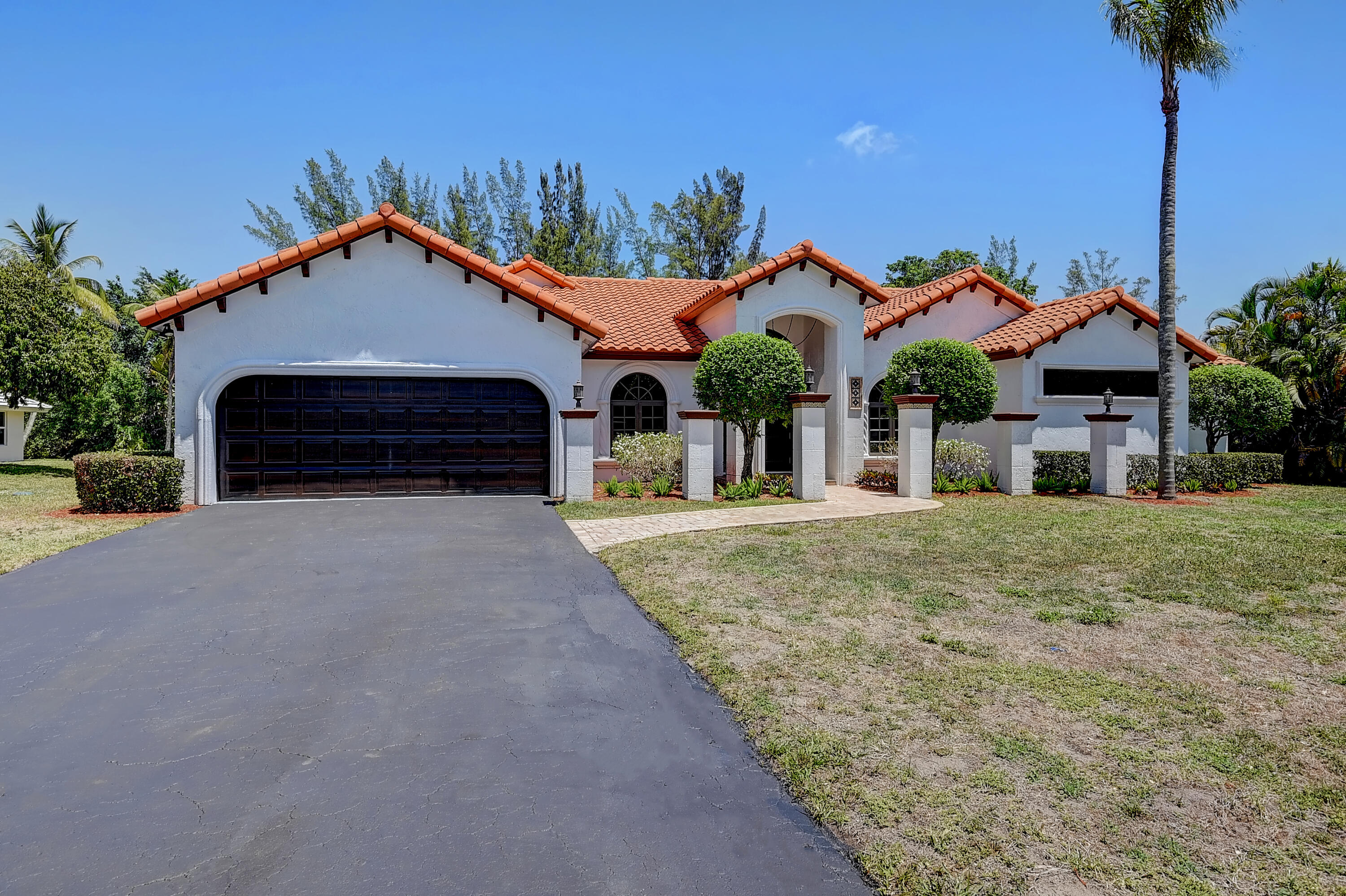 22184 Woodset Lane Boca Raton, FL 33428 - Photo 3 of 66 Expansive driveway with two Car Garage