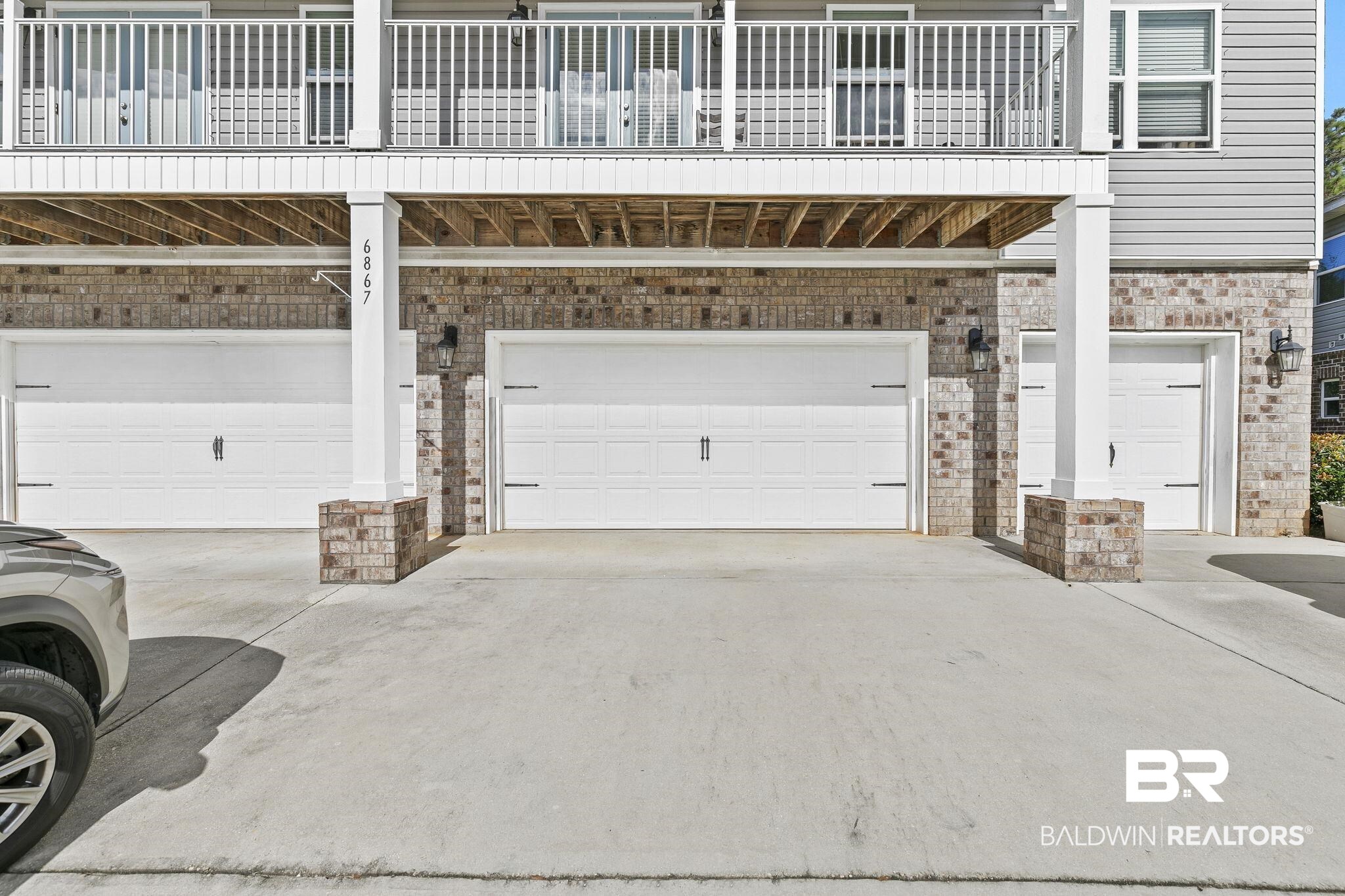 6867 Spaniel Drive, Unit B Daphne, AL 36527 - Photo 2 of 36 View of garage