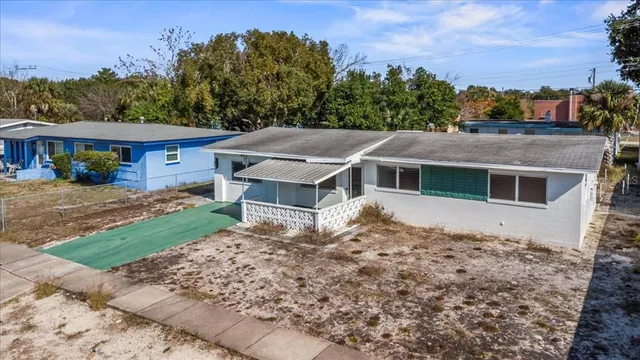 a house with trees in the background