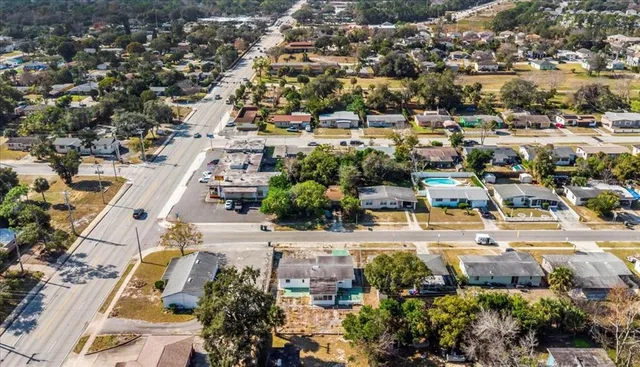 an aerial view of residential houses and outdoor space