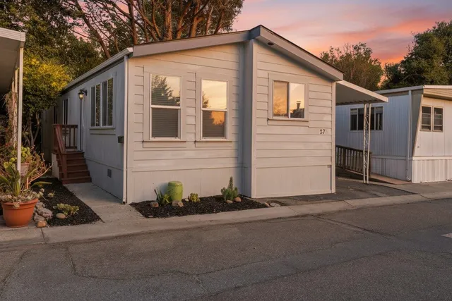 a view of a house with a street