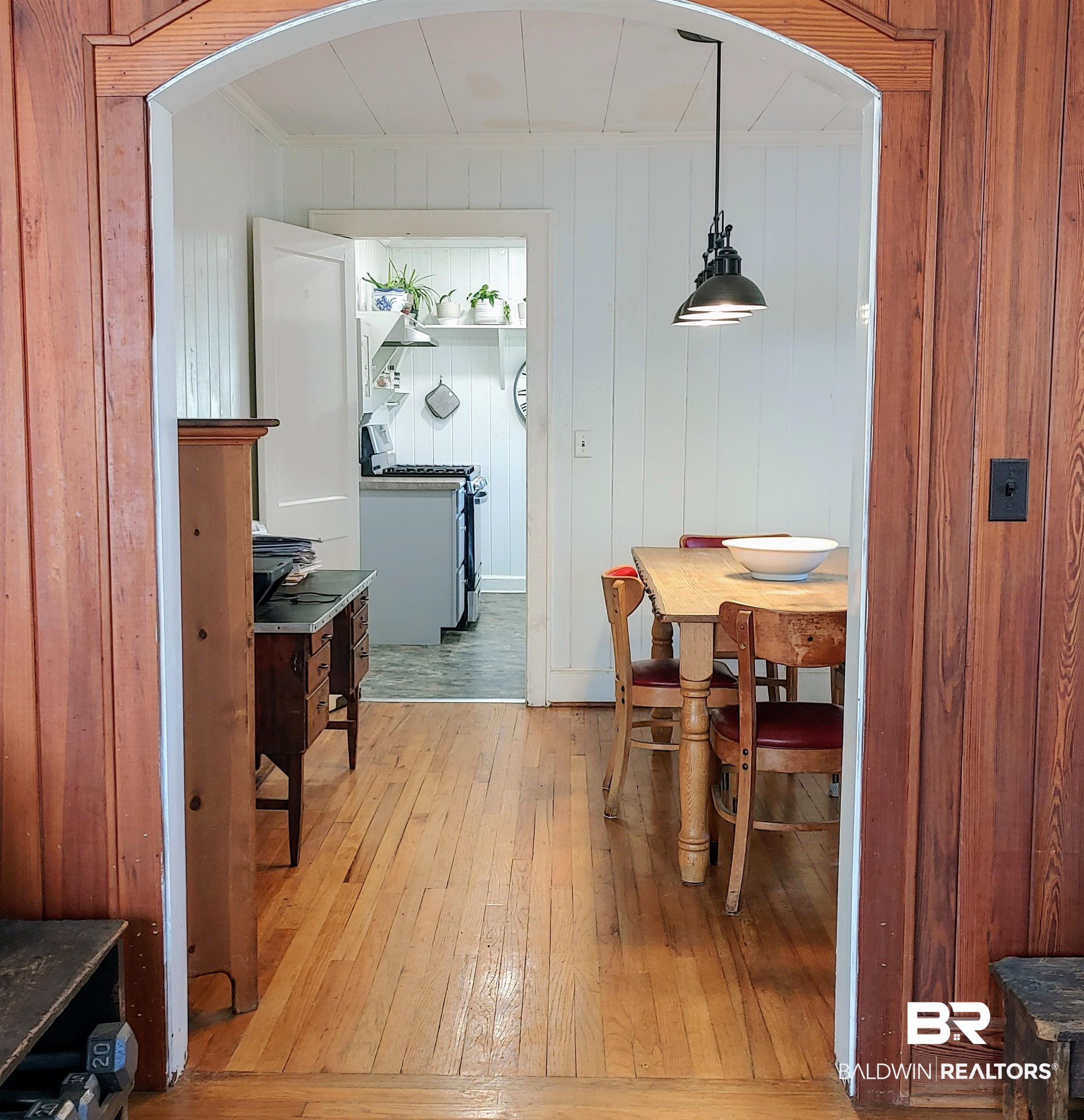 770 Arena Road Frisco City, AL 36445 - Photo 14 of 51 Dining area featuring crown molding, light wood-style floors, and arched walkways