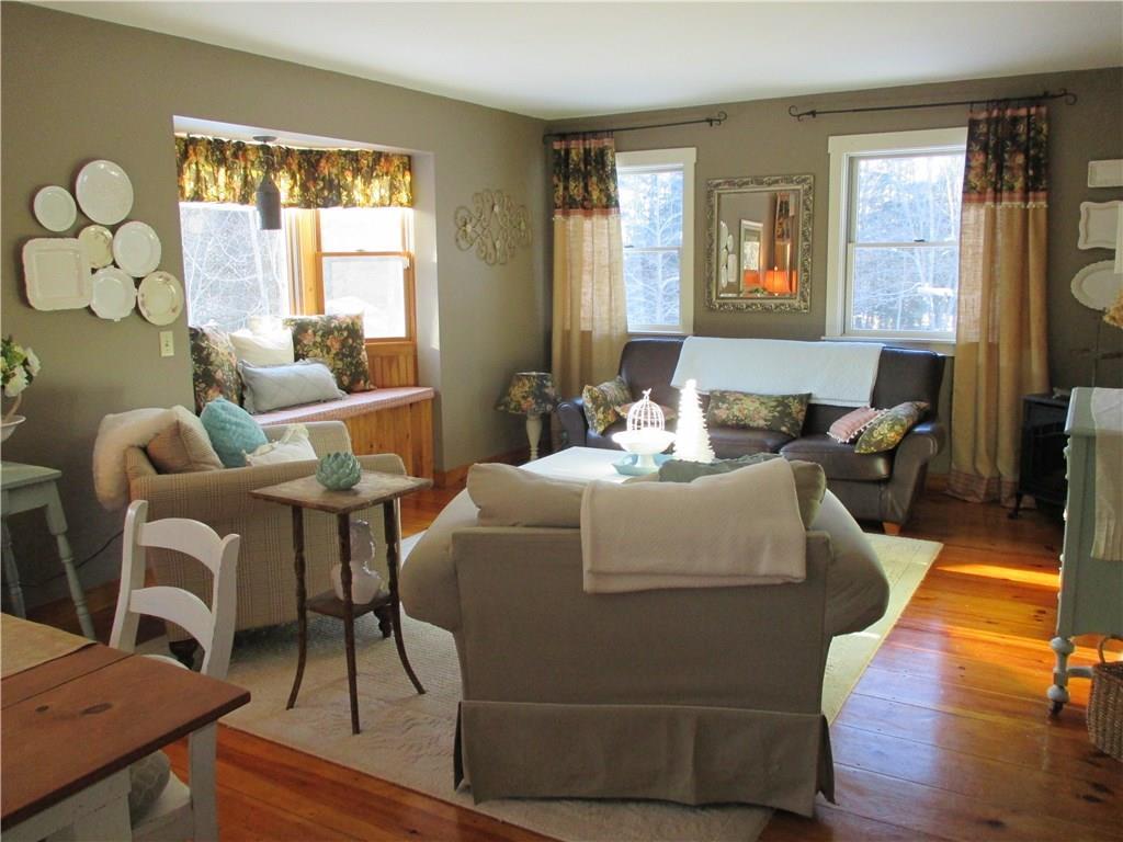 746 Pleasant View Ridge Road South China, ME 04358 - Photo 9 of 29 Sunny living room with gas fireplace.