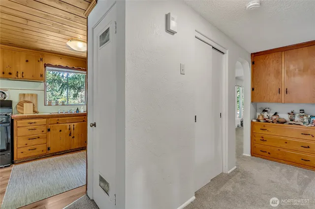 a view of room with window and dresser