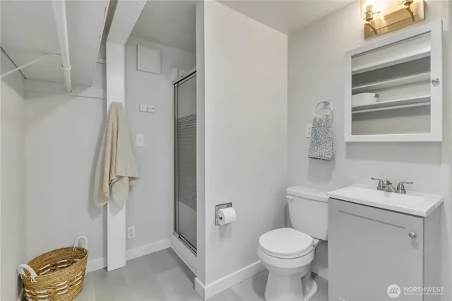 a bathroom with a toilet sink and shower