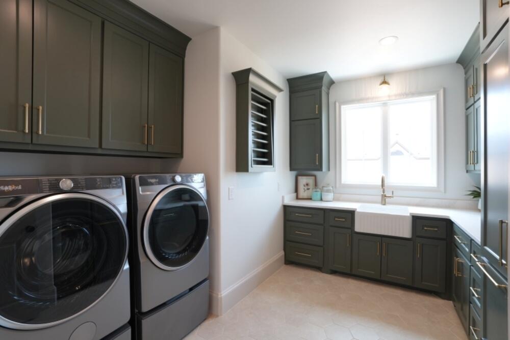 4101 149th Street Lubbock, TX 79423 - Photo 12 of 53 a bathroom with a sink a washer and dryer