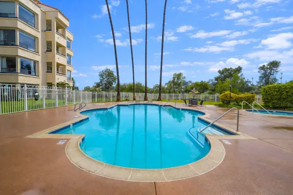 a view of a swimming pool with a lounge chairs
