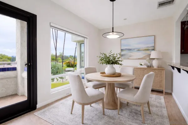 a view of a dining room with furniture window and outside view
