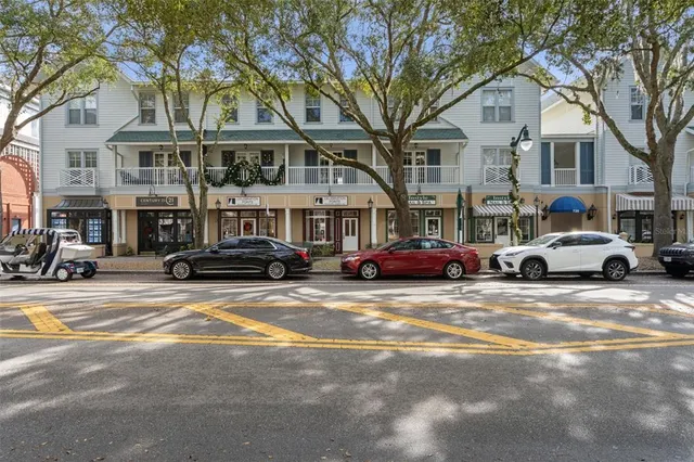 a view of a cars park in front of a brick building