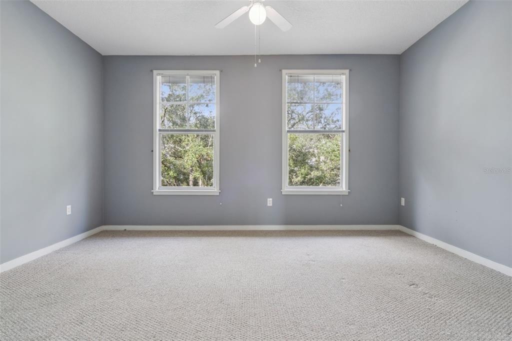 720 Celebration Avenue, Unit 220 Celebration, FL 34747 - Photo 16 of 45 an empty room with windows
