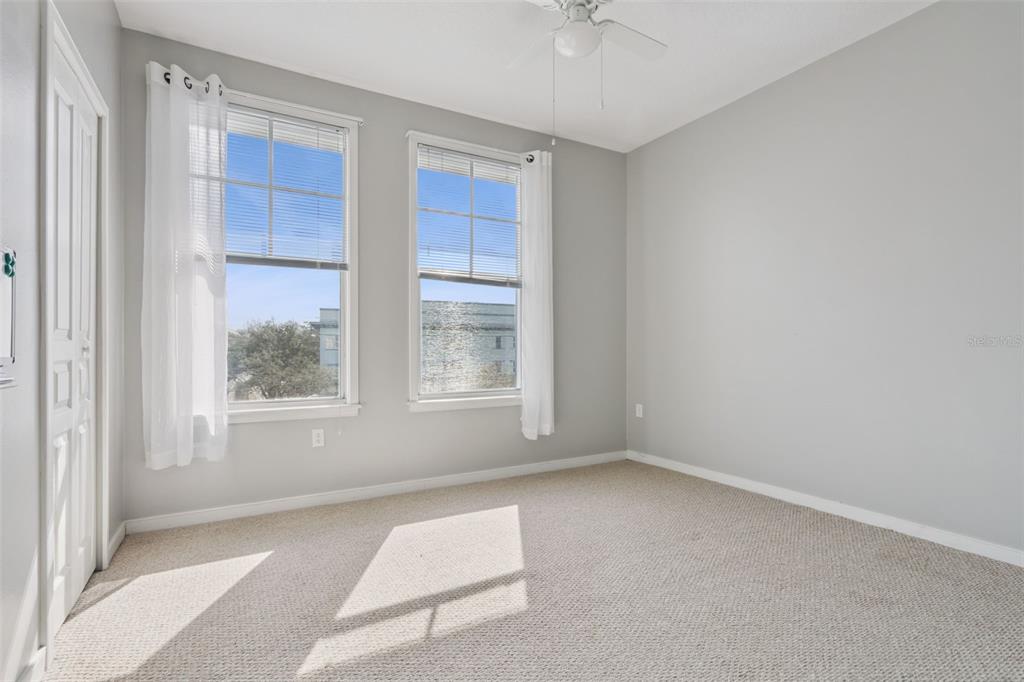 720 Celebration Avenue, Unit 220 Celebration, FL 34747 - Photo 21 of 45 an empty room with windows