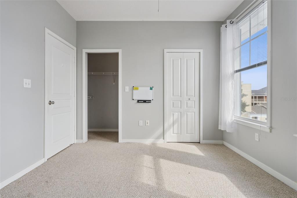 720 Celebration Avenue, Unit 220 Celebration, FL 34747 - Photo 22 of 45 an empty room with windows