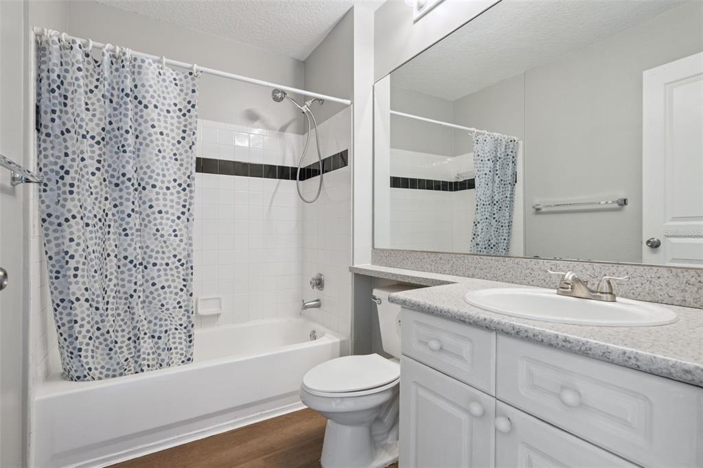 720 Celebration Avenue, Unit 220 Celebration, FL 34747 - Photo 23 of 45 a bathroom with a sink toilet and shower